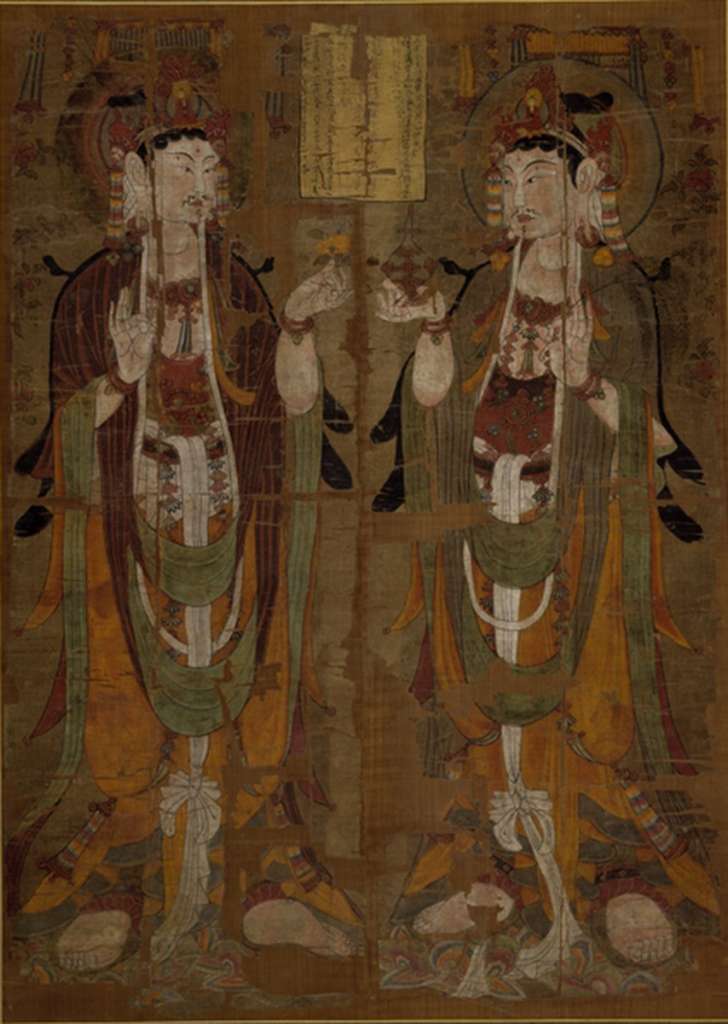 British Museum Top 20 Buddhism 04-1 Dunhuang Two standing Avalokiteshvara 4-1. Two Standing Avalokiteshvara - Cave 17 Dunhuang China, mid 9C AD, 147 x 105 cm. The British Museum has many artifacts that are not on display, like this one of almost 400 priceless Buddhist paintings on silk from the Dunhuang cave complex in China from the Stein collection. The painting shows two almost identical figures of Avalokiteshvara, one of the most popular of the bodhisattvas, identifiable by the small figure of the Buddha Amitabha in his headdress. One of the only differences between the two figures are the attributes that they hold: that on the left holds a flower, that on the right a vase and a willow branch. All three were popular attributes of Avalokiteshvara. The inscription in the centre of the painting translates in part: 'the disciple of pure faith, Yiwen, on his own behalf, having fallen [into the hands of the Tibetans], hopes that he return to his birthplace.' Therefore this example was commissioned to ensure a peaceful life during the period of war with the Tibetans, who finally had to give up Dunhuang in 948 AD. For more information on Dunhuang, check out <a class='a' href='http://idp.bl.uk/idp.a4d'>The International Dunhuang Project</a>. Photo: http://www.britishmuseum.org.
